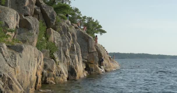 People Standing Rocks Lake — Stock Video