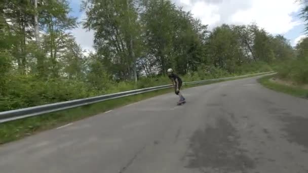 Young Man Longboarding Road — Stock Video