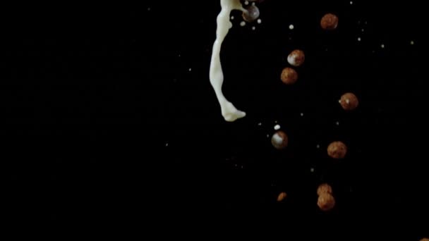 Chocolate Cereal Balls Milk Falling Ultra Slow Motion — Stock Video