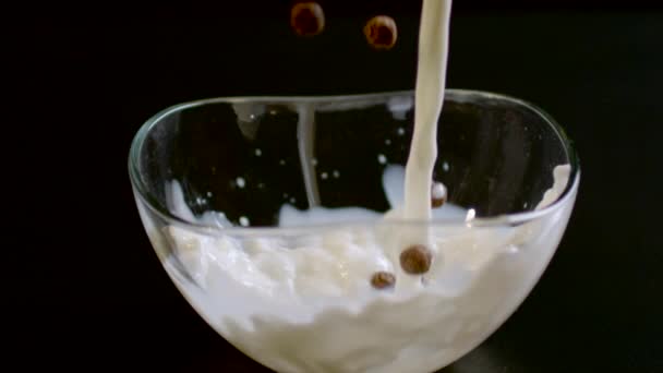 Pouring Milk Chocolate Cereal Balls Bowl Ultra Slow Motion — Stock Video