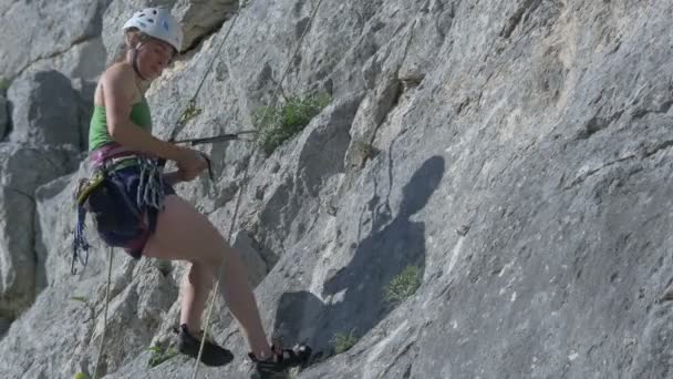 Female Rock Climber Rappelling — Stock Video