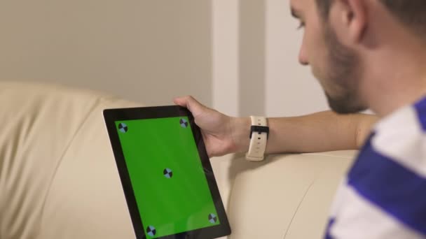 Man Sitting Couch Looking Tablet — Stock video