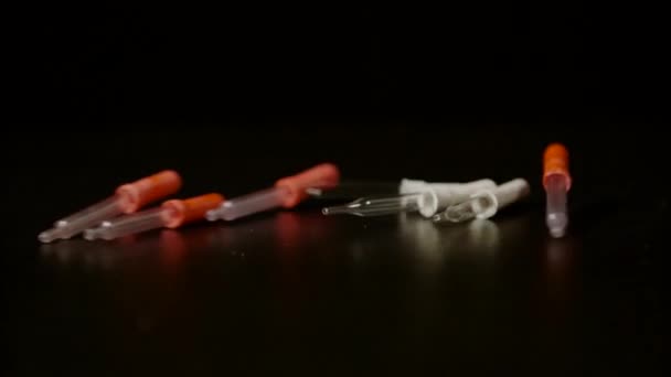 Pipettes Rolling Falling Black Background Ultra Slow Motion — Stock Video