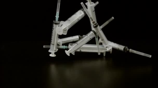 Plastic Medical Syringes Falling Ultra Slow Motion — Stock Video