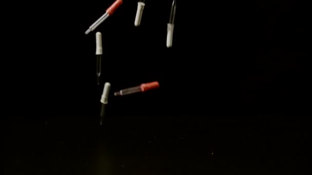 Droppers Falling Black Surface Ultra Slow Motion — Stock Video