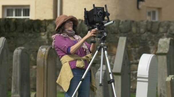 Woman Adjusting Camera — Stock Video