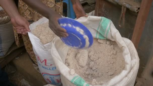 Footage Uganda Lifestyle Putting Flour Bag Another – stockvideo