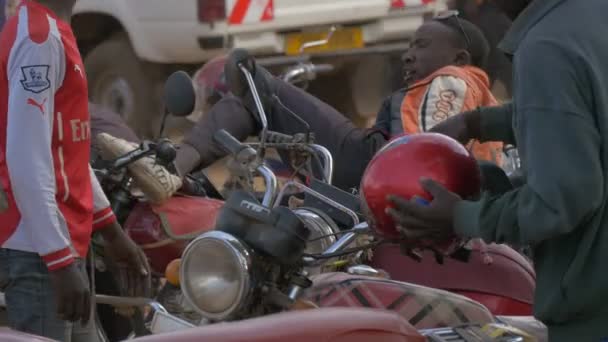 African Men Parked Motorbikes — Stock Video
