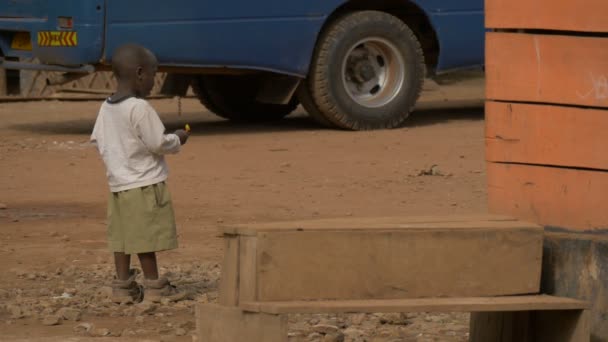 African Boy Eating Lollipop — Stock Video