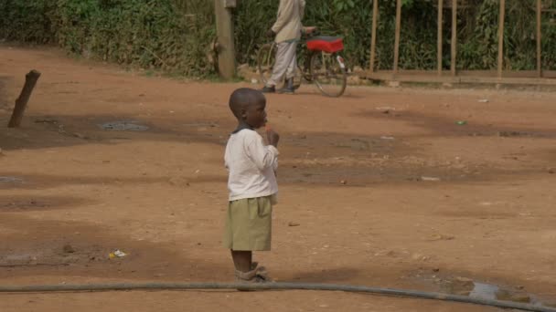 African Child Eating Lollipop — Stock Video