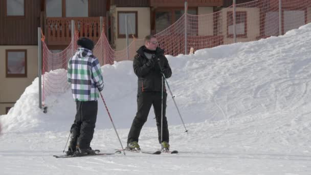 Two Skiers Standing Ski Slope — Stockvideo