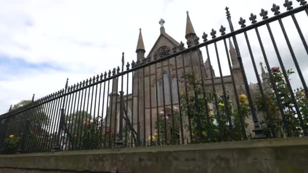 Church Seen Trough Fence — Stockvideo