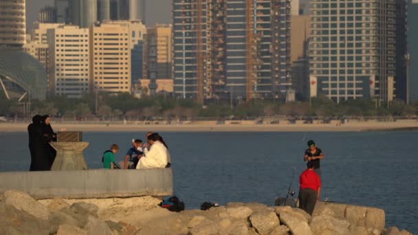 People Relaxing Fishing Seafront Abu Dhabi — Stock video