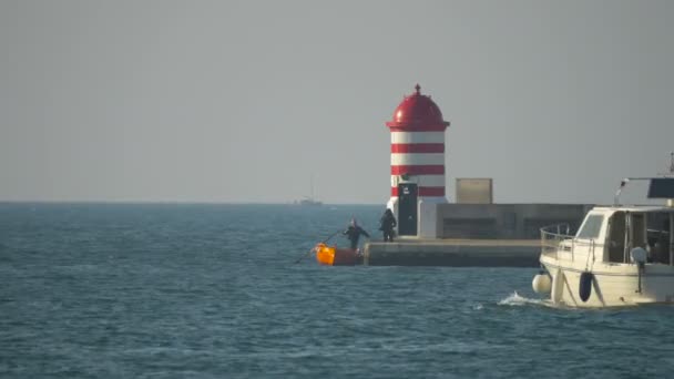 White Boat Sailing Out Port — Stock Video