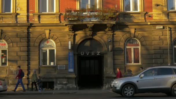 People Passing Old Building — Video Stock