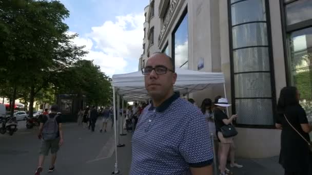 People walking near Louis Vuitton store , Stock Video