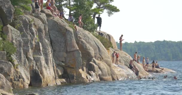 People Swimming Jumping Lake — Stock Video