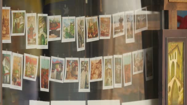 Postcards Paintings Window — Stock Video