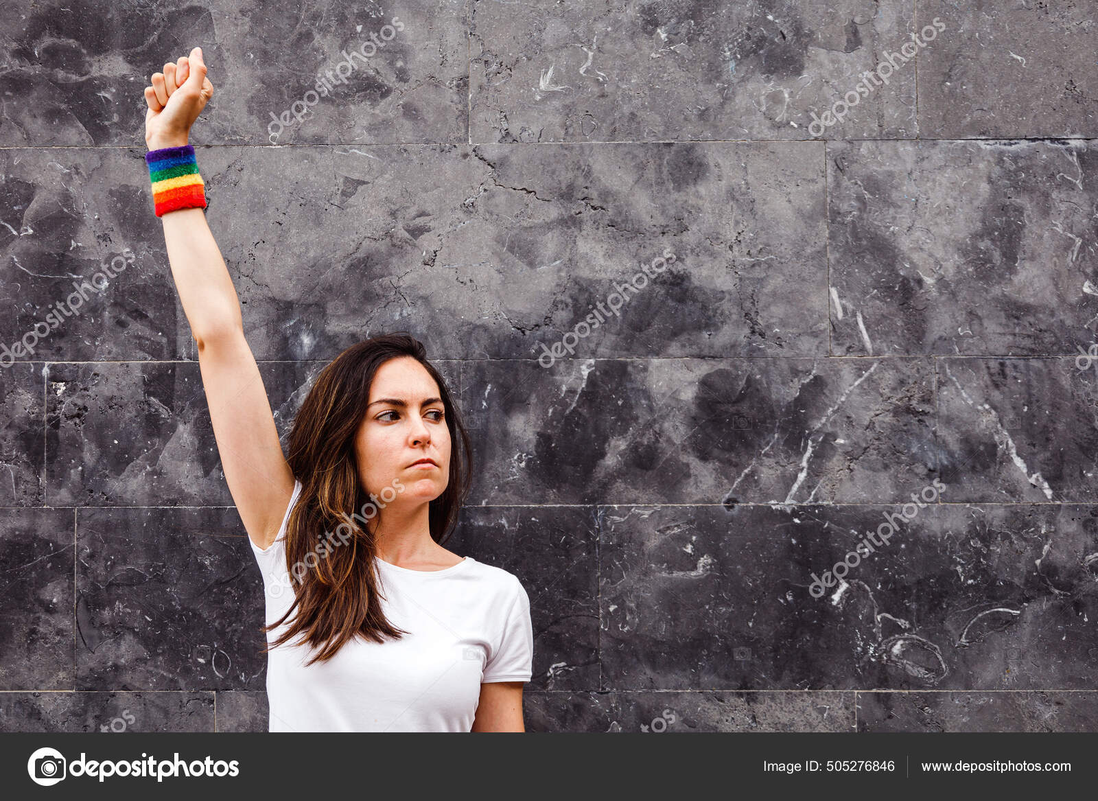 Young Lesbian Raising Fist Rainbow Armband Neutral Background Copy Space  Stock Photo by ©alvan.ph 505276846