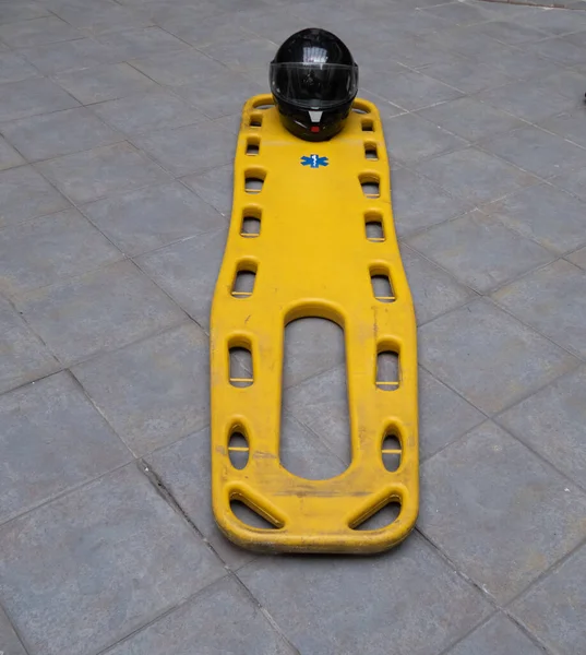 Yellow Ambulance Stretcher Floor Next Motorcycle Helmet — Stock Photo, Image