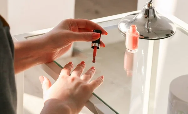 Young Woman Paints Her Nails Pastel Nail Polish Glass Dressing — Stock Photo, Image