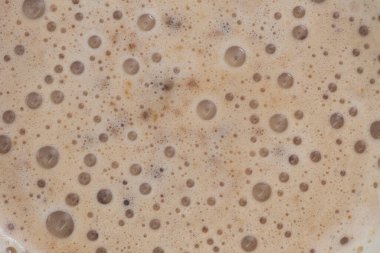 Lezzetli bir kapuçino kahvenin dokusuna yakından bakın..