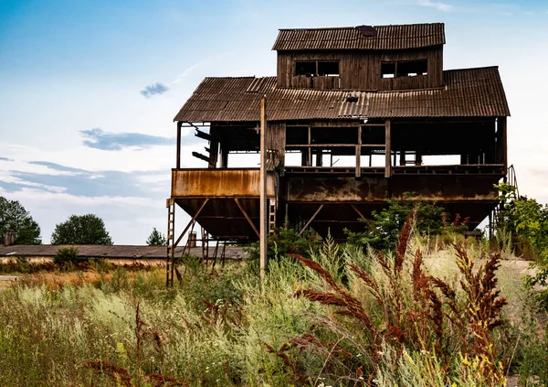 old rusty barn for storing grain crops against the background of the sky. High quality photo