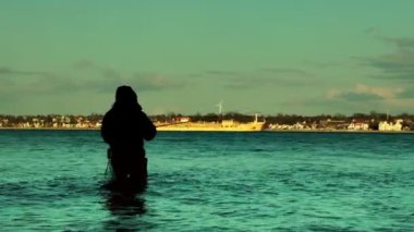 Balıkçı ve gün batımında