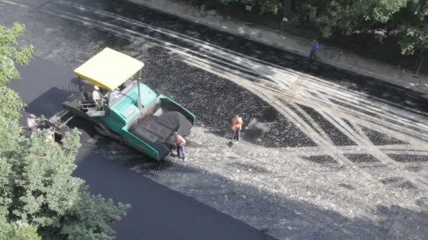 Construction team asphalting road — Stock Video