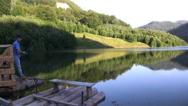 Man fishing on lake — Stock Video