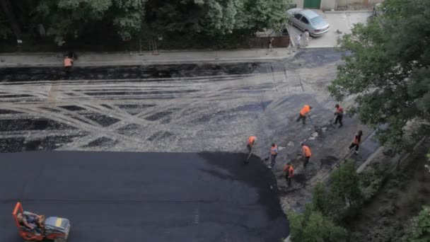 Construction team  asphalting road — Stock Video