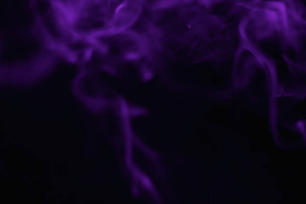 Purple smoke blurred on a black background