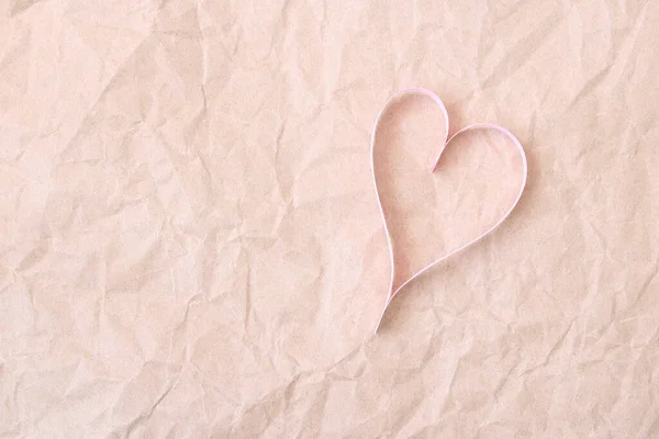 Pink paper hearts on brown paper background for design and Valentines Day - Image