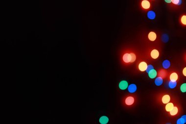 Yuvarlak Noel ışığı ve kutlamaların soyut uydurma arka planı.