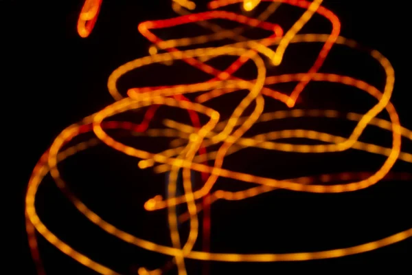 Bulanık Siyah Arkaplandaki Işık Soyut Resmi — Stok fotoğraf