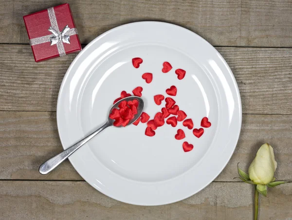 Little red hearts in the plate — Stock Photo, Image
