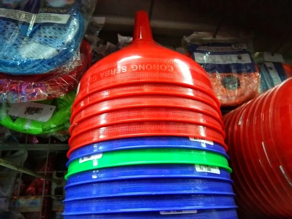 the stack of plastic funnel in the supermarket