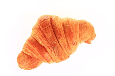 Arka planda taze kruvasanlar var.