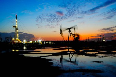 The oil pump, industrial equipment. Oil field site, oil pumps ar