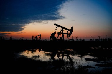 The oil pump, industrial equipment. Oil field site, oil pumps ar