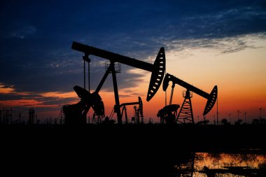 The oil pump, industrial equipment. Oil field site, oil pumps ar