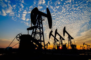 The oil pump, industrial equipment. Oil field site, oil pumps ar