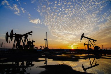 The oil pump, industrial equipment. Oil field site, oil pumps ar