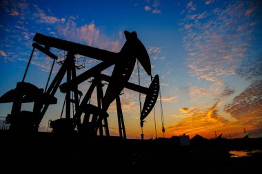 The oil pump, industrial equipment. Oil field site, oil pumps ar