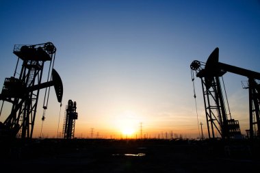 The oil pump, industrial equipment. Oil field site, oil pumps ar