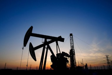 The oil pump, industrial equipment. Oil field site, oil pumps ar