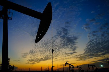 The oil pump, industrial equipment. Oil field site, oil pumps ar