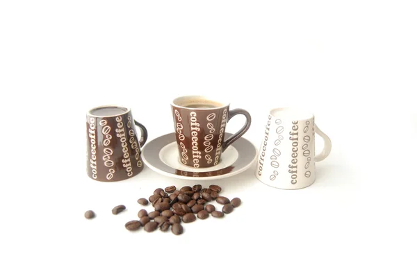 Три миниатюрные кофейные чашки — стоковое фото