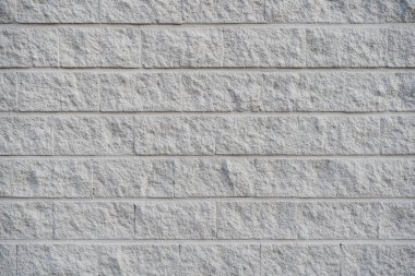 Gri ve sert beton duvar. Beton blok duvar arkaplanı ve dokusu.