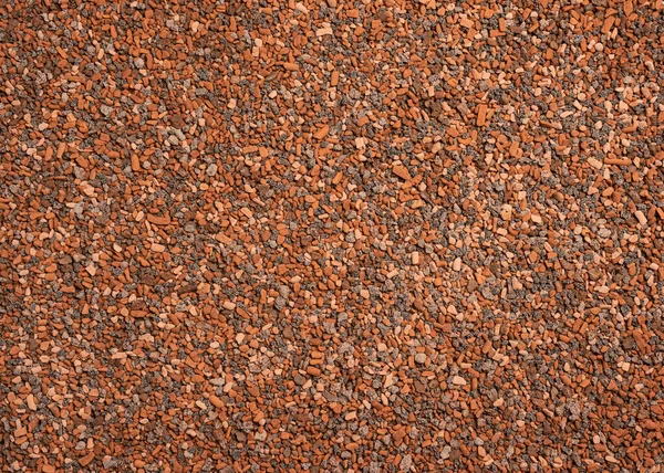 小さな道石の背景暗い砂利の小石の質感シームレスなテクスチャ — ストック写真